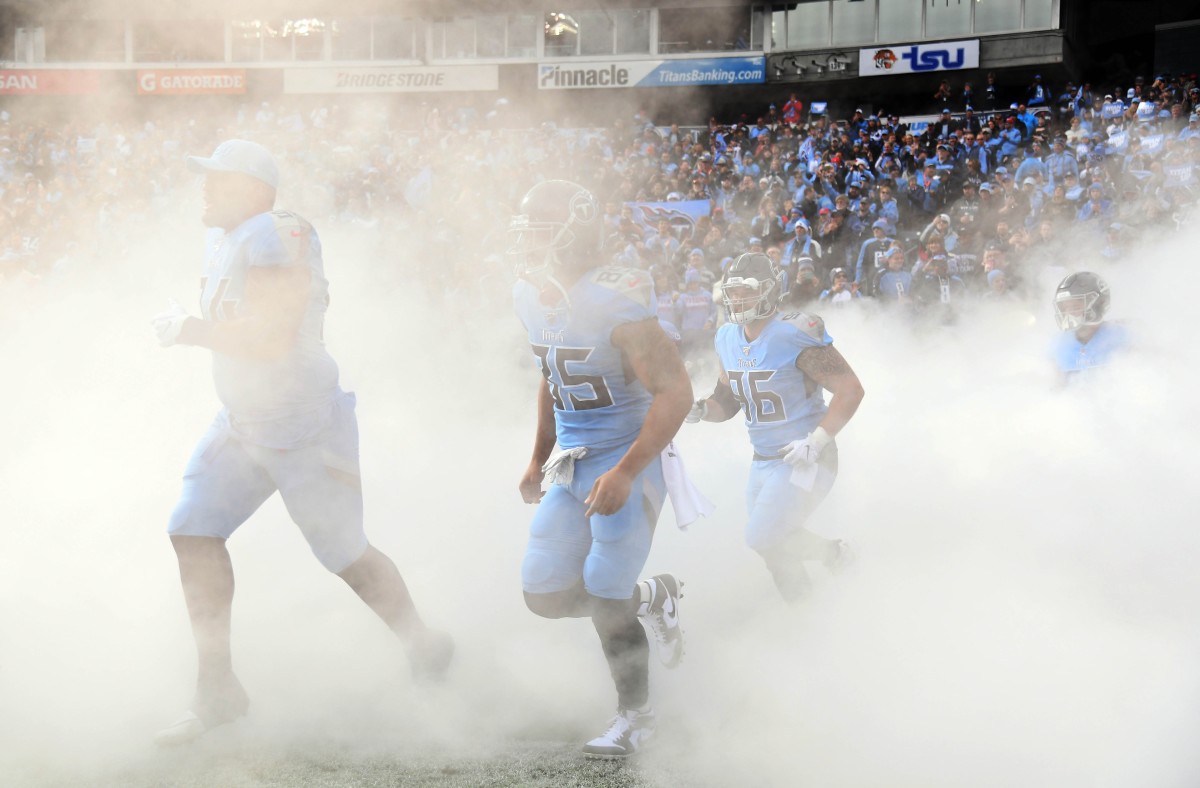 Tennessee Titans players take the field during player introductions before the game against the Houston Texans at Nissan Stadium.